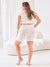 Rear view of Cooling 9-inch Halo slip shorts in white on model showcasing mid-thigh coverage and smooth cooling fabric in bright studio