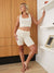 Three-quarter front view of The Cooling 7-inch vanilla slip shorts on model showing form-fitting mid-thigh coverage