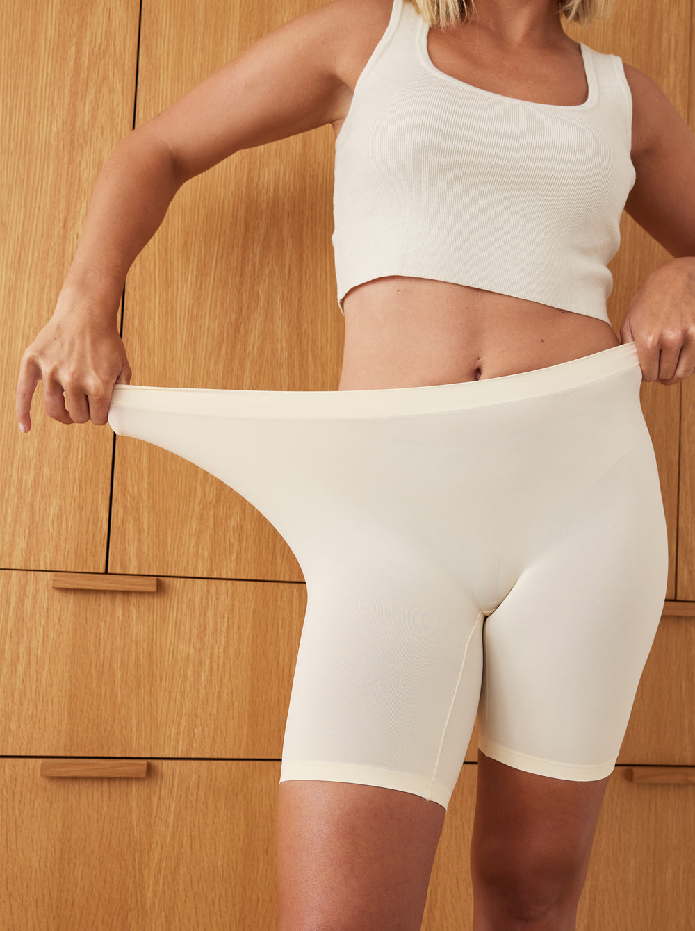 Front view of The Cooling 7-inch Vanilla slip shorts worn, showing high-stretch waistband, mid-thigh fit and cooling fabric