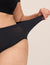 Close-up side view of the black WhispAir Cooling Brief showcasing stretched fabric and full coverage with a neutral background