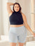 Front view of Cooling 9-inch Chambray anti-chafe shorts showing blue cooling fabric and waistband on model in room