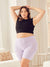 Front view of 9-inch Cooling Anti-Chafe shorts in lilac on model showing high waist and smooth seamless legs